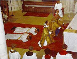 Candidates for Catholic priesthood lie prostrate in the service of ordination.