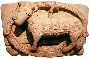 Agnus Dei, detail of lost portal, workshop of the master of Cabestany, at monastery Sant Pere de Rodas,  Catalonia, Spain, now at Marès Museum, Barcelona.