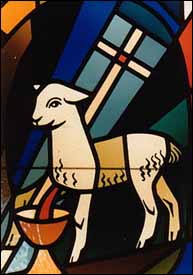 Stained glass showing Lamb of God with vexillum and chalice, from chapel that used to be part of a convent (now a Baptist church and school complex) in El Cajon, California.