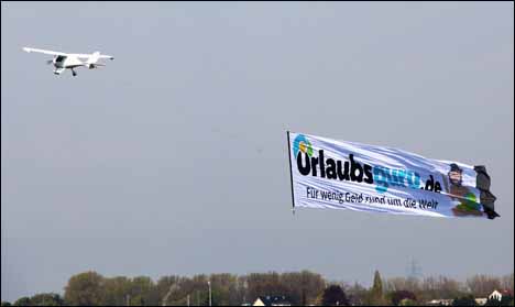 Banner being towed by small plane.