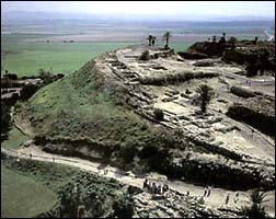 The Tell of Megiddo (Armageddon) rising above the Jezreel Valley where the final battle will be fought.